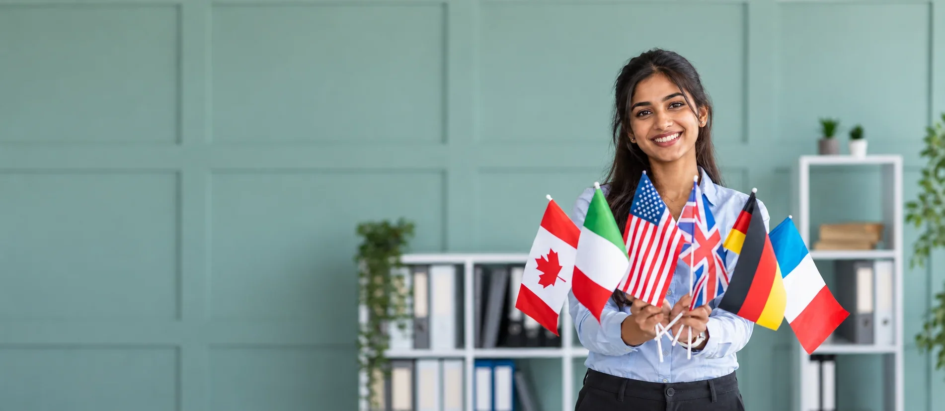Versatile Study Abroad consultancy welcoming students in modern office with global flags. Best Study Abroad consultancy in Nashik and Pune